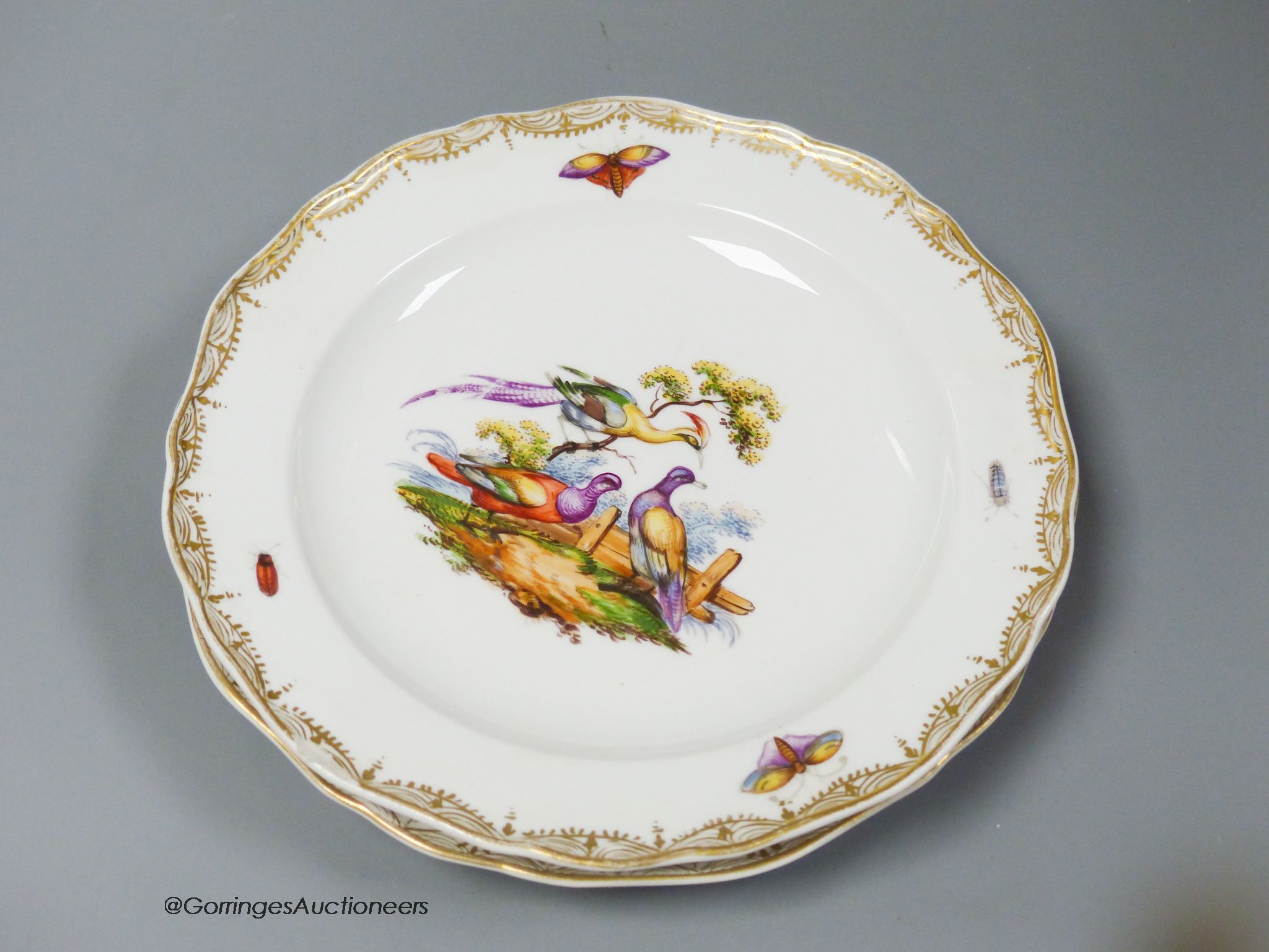 A set of six Meissen dessert dishes, painted with birds,factory seconds, 25.5cm diameter